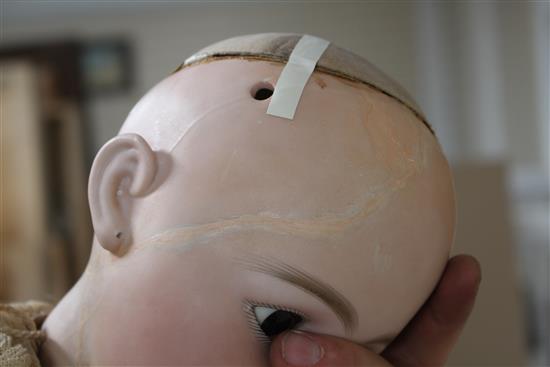 A Simon & Halbig 949 doll, 32in., cracked and damage to top of head at front